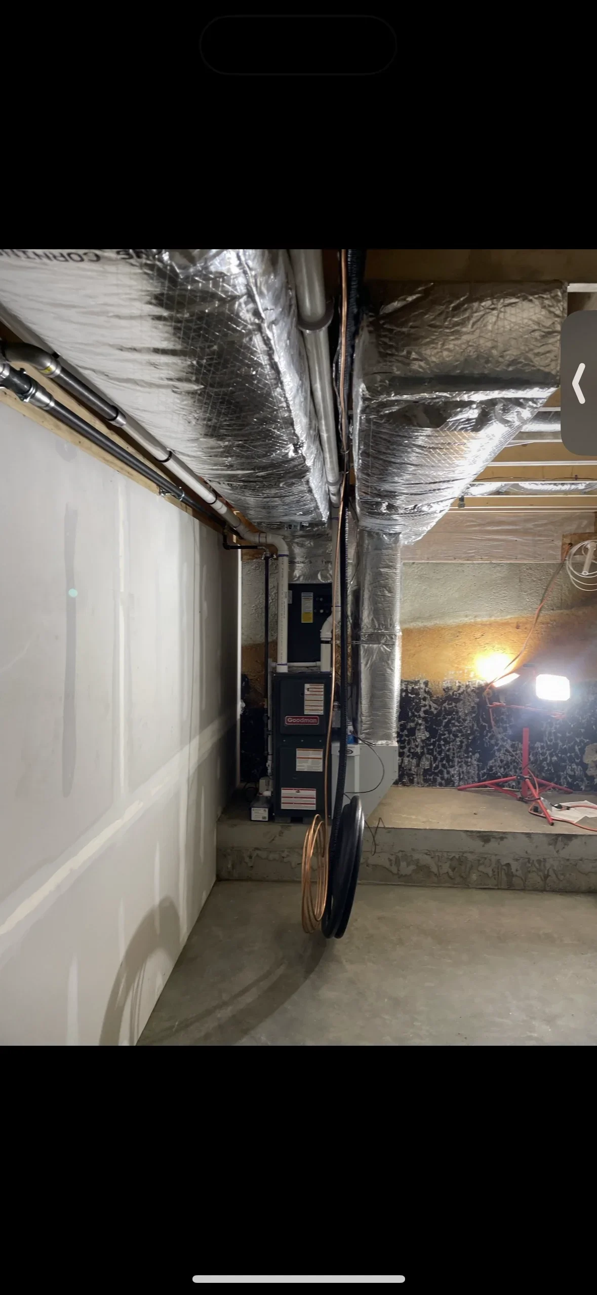 Newly installed furnace with insulated ductwork in basement